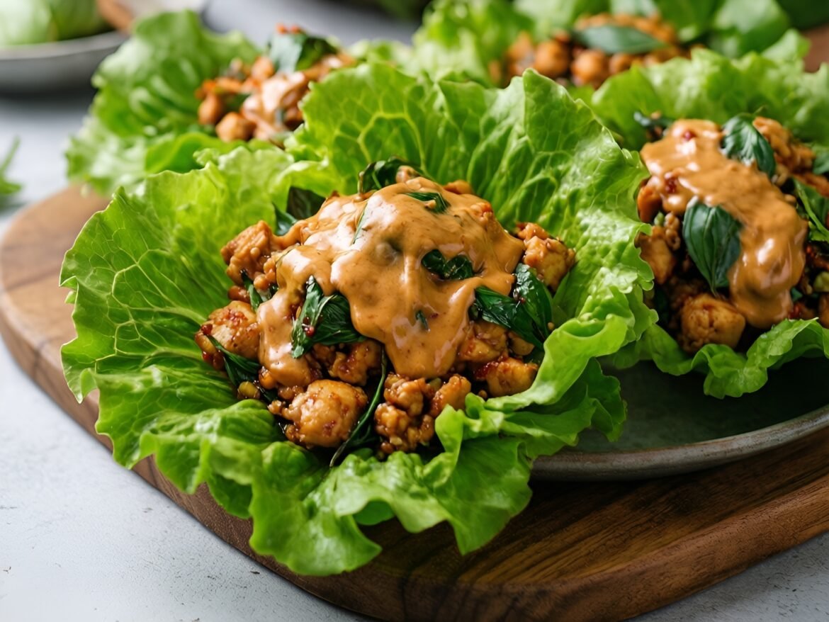 Savory Thai Basil Chicken Lettuce Wraps with Creamy Spicy Peanut Sauce